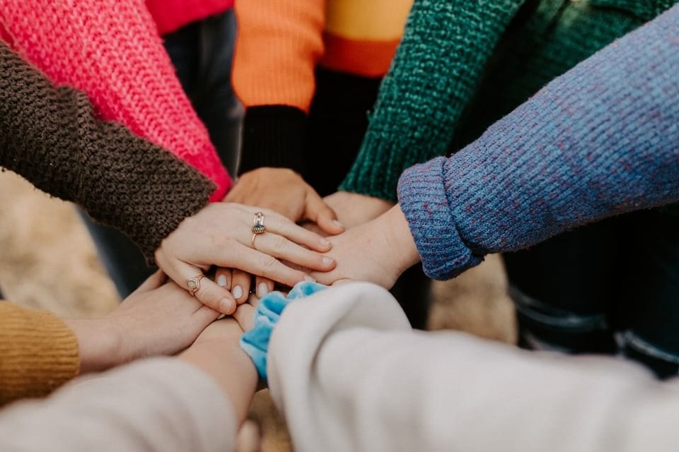 Older people and organisers together during an activity.